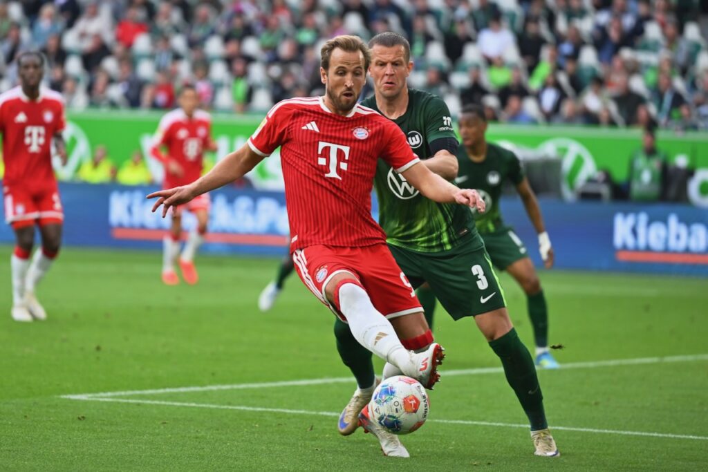 Kane penalty miss as Olise rescues Bayern to pile pressure on Wolfsburg