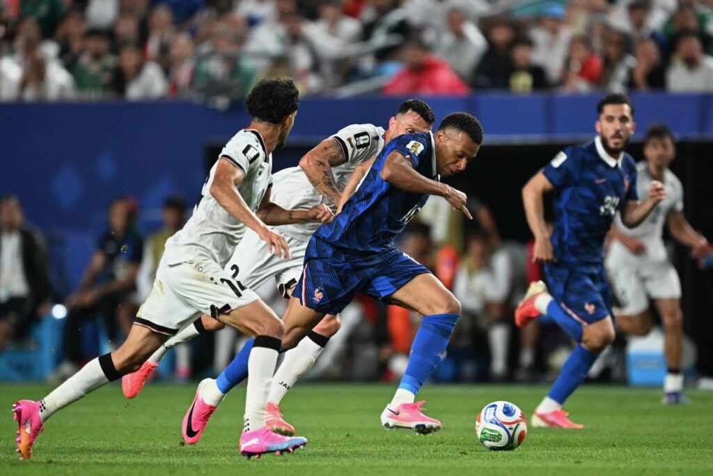 Mbappe scores twice as France beat Iraq at World Cup after two hour storm delay