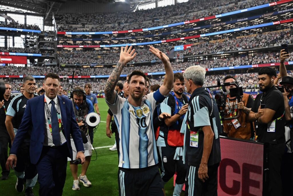 Messi sets World Cup scoring record as stars outshine weather