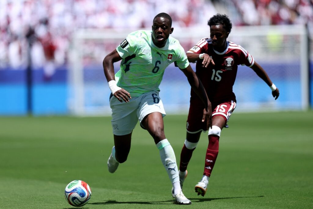 Qatar earn first ever World Cup point with late goal