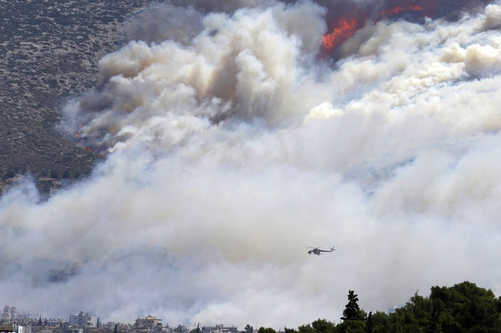 Toxic smoke blankets Greece’s second-largest city after wildfire sparks factory fire